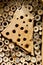 Insect hotel for wild bees and other insects. made of wood and b