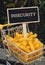 INSECURITY text on Blackboard label Shopping trolley cart Filled With Pasta on agriculture background. Food and