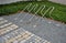 inserting and locking the bicycle on the square. interlocking paving and granite cubes in stripes. red  gray