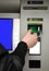 Inserting plastic card visa into ATM