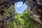 Inside cave with sunlight through hole on cave ceiling. Phraya N