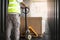 Inside container truck. Warehouse worker working with hand pallet truck loading a large box on pallet . Cargo Shipment, Delivery