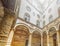 Inside courtyard of Palazzo Vecchio in Florence with decorated columns, arches and frescoes