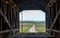 Inside A covered bridge, looking out