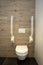 Inside disable toilet. toilet with grab bars for senior or a handicapped person,disable concept. modern design