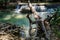 Inside Erawan Waterfall Park with amazing views, mini waterfalls, lakes and bridges. Beautiful landscape. Cozy place