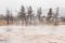 Inside flood area of geyser basin covered by smoke