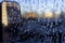 Inside frozen car, glass view, window covered with ice, early morning winter season