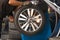 Inside a garage - changing wheels-tire during spinning wheel/Car wheel tire replacement - changing wheels-tires