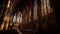 Inside the majestic gothic basilica, the illuminated stained glass window illuminates the altar