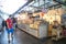 Inside market hall showing food court area with candy sweet confectionery stall showing display