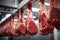 Inside the meat industry: rows of fresh cuts on hooks