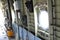 Inside the military aircraft there is a wall and portholes