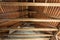 Inside an old house looking upside at the ancient wooden roof framework