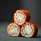 Inside-out Sushi Set. Pyramid of three sushi. Rolls in masago or tobiko caviar on gray blurred background. Healthy