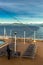 Inside Passage, BC, Canada - September 13, 2018: Cruise ship worker stacking outdoor loungers in the early evening.