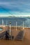 Inside Passage, BC, Canada - September 13, 2018: Cruise ship worker stacking outdoor loungers in the early evening.