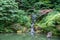 Inside a peaceful japanese garden, a Japanese pagoda rock statue in Portland