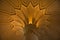 Inside of Pena Palace in Sintra, Lisbon district, Portugal. Close up of a corinthian capital and decorated ceiling.