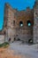 Inside ruin old ancient stone destroyed tower with small windows of Genoese fortress in Feodosia made of sand brown colored bricks