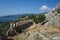 Inside Simena castle wall and tranquil rural Mediterranean coast landscape in Simena Kalekoy, Turkey. Old stone fortress