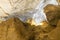 Inside the Sung Sot Cave Surprise Grotto in Ha Long Bay with thousands of stalactites and stalagmites