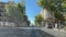 Inside view of a car stopping at a red traffic light while driving through the streets of Madrid near the Moncloa arch