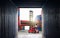 Inside View of Cargo Container. Crane Tractor Lifting up Stacking Cargo Containers. Handling of Logistics Transportation