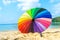 Inside view colourful umbrella and beach background