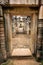 An inside view of the gates of the ancient Khmer temple built of red sandstone and laterite and dedicated to the Hindu god Shiva