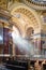 Inside view of St. Stephen\'s Basilica in Budapest lightened by dramatic sunshine.