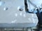 Inside of the washing machine - top view. Drum, centrifuge and home appliance parts. Washing machine cover removed. Plastic and