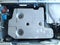 Inside of the washing machine - top view. Drum, centrifuge and home appliance parts. Washing machine cover removed. Plastic and