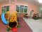 Inside the wide hall of a kindergarten the games to entertain ch