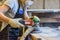 Inside the Wood Industry or Lumber Industry private sector, production of forest products. Female carpenter making slab furniture