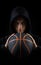 Insolent hooded boy holding basketball