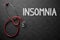 Insomnia - Text on Chalkboard. 3D Illustration.