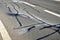 Inspection activity, checking the condition of motorway road barriers. pruning of frost cracks, joints and cracks in the asphalt s