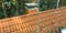 Inspection of the red tiled roof of a single-family house, inspection of the condition of the tiles on one roof side.