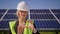 Inspector Engineer Woman Holding innovative Tablet Working in Solar Panels Power Farm, Photovoltaic Cell Park, Green