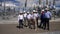 Inspectors in helmets walk along electrical substation