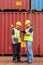 Inspectors standing containers