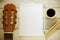 Inspirational background with a Spanish classical guitar on a wooden table