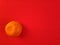 inspirational chinese new year concept image of a tangerine fruit in red colour background