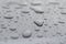 Inspirational heart shaped rain water drop on gray surface