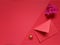 inspirational image of red envelope, golden rings and flower in red colour background