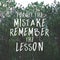 Inspirational and motivation quote `Forget the Mistake Remember the Lesson.` on forest background.