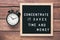 Inspirational motivational business quote Concentrate. It Saves Time and Money words on a letter board on wooden background near