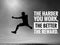 Inspirational motivational quote - The harder you work, the better the reward. On blurry background of silhouette of a man jumping