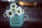 Inspirational motivational quote - If you can be anything. Be kind. With cup of coffee or tea with white daisy flowers.